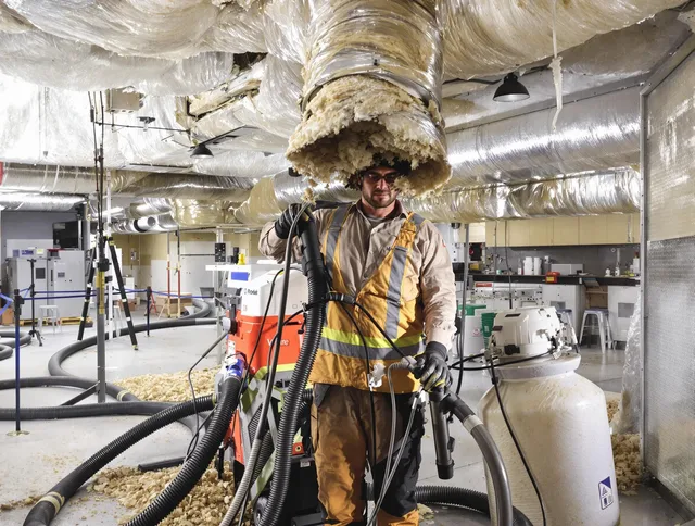 Professional vacuum insulation removal by Sudbury Air Duct Cleaning expert in Sudbury